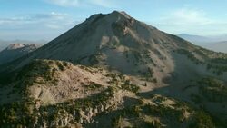 Aerial approach to the majestic Lassen Peak, Lassen Volcanic National Park, California. Stock Footage