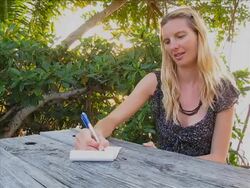 Young lady writing a funny letter Stock Footage