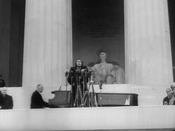 1939 MONTAGE LA WS Marian Anderson singing on steps of Lincoln Memorial during open-air concert on Easter Sunday, April 9, 1939 / WS PAN Crowd listening to concert with Reflecting Pool and Washington Monument in background / Washington, DC, USA Stock Footage