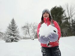 MS Girl playing in snow during snow storm / Yarmouth, Maine, USA Stock Footage