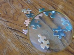 Magnifying Glass and Puzzle Stock Footage