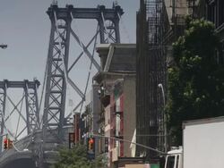 Close up of apartment buildings and the Manhattan Bridge.  Daytime Stock Footage