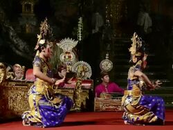 MS Balinese girl dancers performing Nyamar Dance (Love Story) in Puri Saraswati temple AUDIO / Ubud, Bali, Indonesia Stock Footage