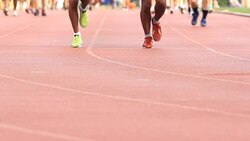 Foot, running exercise in stadium Stock Footage