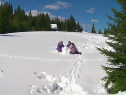 HD CRANE: Family Rolling A Snowball Stock Footage