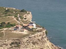 MS AERIAL ZO Shot of control tower at beach near Leucate city / Languedoc Roussillon, France Stock Footage