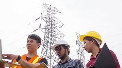 HD CRANE : group of electrical engineer working together at electric tower site. Stock Footage