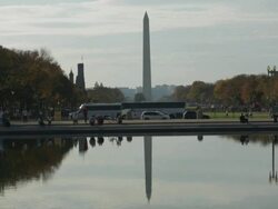 WS View of Washington monument with traffic and reflection in water / Washington, District of Columbia, United States Stock Footage