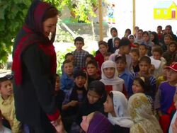 MS PAN ZO POV Shukria Barakzai walking  toward center of  children at  daycare center AUDIO / Kabul, Province, Afghanistan Stock Footage
