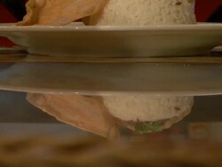 CU ZO Reflection of rice dish on table at fancy restaurant / Phnom Penh, Cambodia Stock Footage