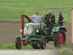 MS Grandpa and boys with tractor / Rommelfangen, Rhineland-Palatinate, Germany                         Stock Footage