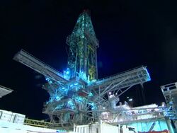 Low Angle static , Lights illuminate an offshore drilling rig at night. / New Orlean, LA Stock Footage