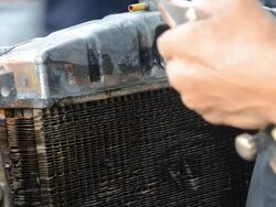 paint compatibilizer on cap of bulldozer Radiator Stock Footage