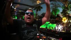 Brazilian DJ raises the roof and sings into camera at exclusive poolside club Stock Footage