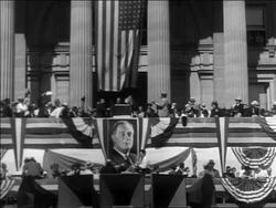 B/W 1932 long shot Franklin Roosevelt at podium at rally during campaign with people cheering + clapping Stock Footage