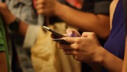 Crowded people in the mass public transportation using their phone Stock Footage