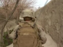 MS POV Group of soldiers walking in row / Musa Qala, Helmand Province, Afghanistan. Stock Footage