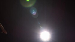 A runner hands a baton over to his teammate during a relay race. Stock Footage
