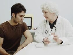 Young Man Consulting Female Doctor Stock Footage
