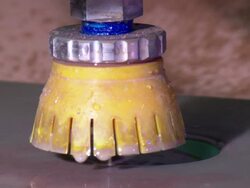 Close Up pan-left - A precision laser cutter cuts circles in a slab of stone /  Wisconsin, United States Stock Footage