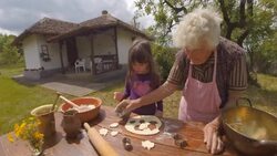Cooking With Grandma-Beautiful Little Girl Learns How To Make Cookies in The Bright-lit Vintage Kitchen Stock Footage