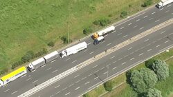 British tourists have vented their fury at Calais ferry workers after thousands of families' holidays were wrecked by twelve-mile tailbacks when French wildcat strikers burned tyres and blocked the Channel Tunnel today. News Clip