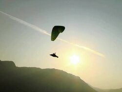 HD: Silhouette Of A Paraglider At Sunrise Stock Footage