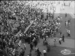 B/W 1955 high angle long shot crowd surrounding Brooklyn Dodgers dugout at end of World Series / NYC Stock Footage
