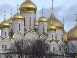 Low Angle static - Clouds drift behind Moscow's towering Cathedral of the Annunciation. / Moscow, Russian Federation Stock Footage