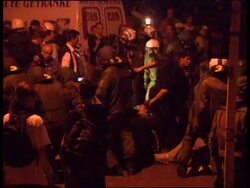Night shots of police clashes with protestors Instructional Video