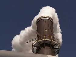 Low angle shot of steam rising from factory pipe. Stock Footage