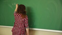 Young student writing math formula Stock Footage