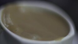 SLO MO CLOSE-UP SELECTIVE FOCUS Sugar pouring into coffee Stock Footage