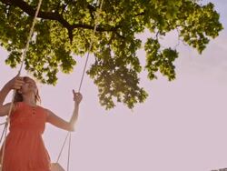 SLO MO Carefree girl swinging in the nature Stock Footage