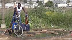 Migrant workers survive in makeshift shacks News Clip