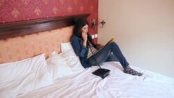 Pretty young woman talking with room service. Stock Footage