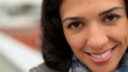 Young woman in love smiles sweetly at camera Stock Footage