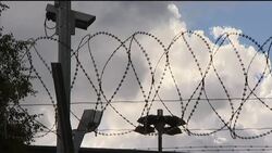 Suspect''s high school, shooting range and prison where he''s being held News Clip