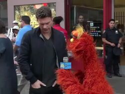 Ryan Seacrest giving directions to Sesame Street to one of the Sesame Street Characters in front of the Times Square Subway Station Stock Footage