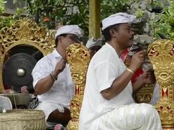 MS Balinese musicians playing traditional Gamelan Orchestra in Pura Desa temple AUDIO / Ubud, Bali, Indonesia, Asia Stock Footage