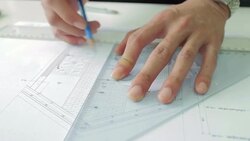 Architect working on blueprint,Dolly Shot Stock Footage