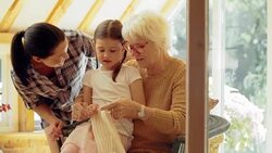 Grandmother and granddaughter knitting Stock Footage