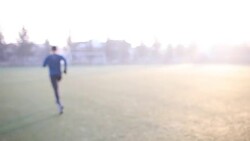 Man jogging in park on cold winter day Stock Footage