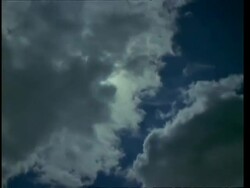 Sun behind T/L clouds left to right Stock Footage
