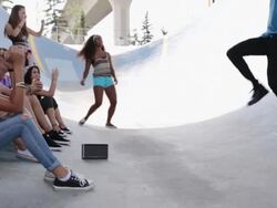 Teenagers dancing at skateboard park Stock Footage