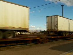 MS, PAN, Trailer containers on rail being pulled through Needles train station, California, USA Stock Footage