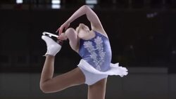 SLO MO TU Female figure skater performing catchfoot layback spin Stock Footage
