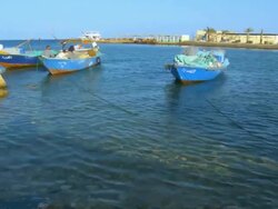 WS PAN Fishermen sitting in boat at red sea bay / Hurghada, Red Sea coast, Egypt Stock Footage