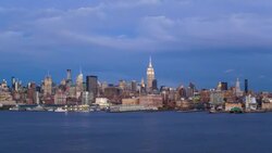 Manhattan, Dusk view of the Empire State Building and Midtown Manhattan across the Hudson River, New York, United States of America - Time lapse Stock Footage