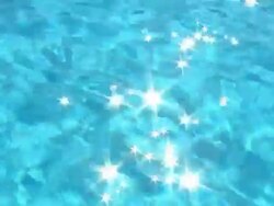 Sun reflections twinkle off of water surface Stock Footage
